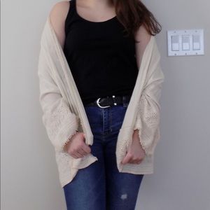 A lightweight, cream colored kimono.